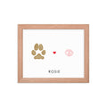 tan dog paw print with pink dog nose print in plain wood picture frame