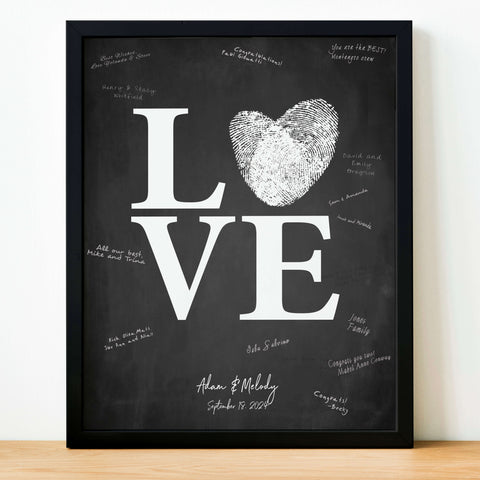 wedding guest book alternative with guest signatures surrounding the word love that is changed to include a heart made of fingerprints