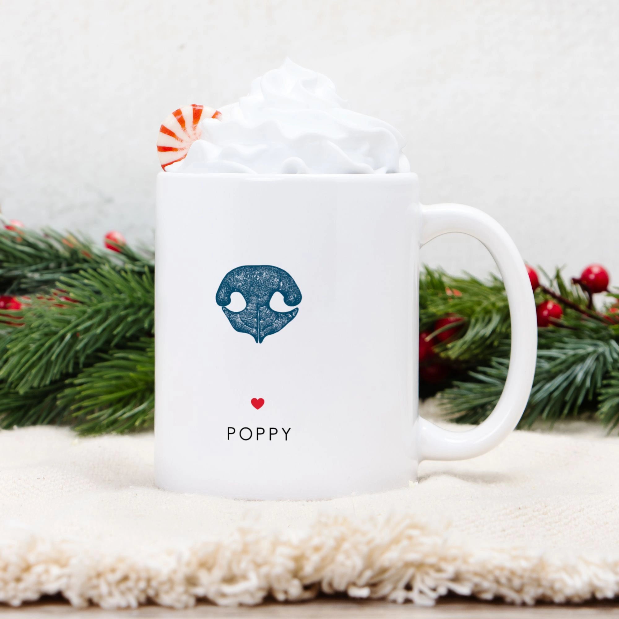 White mug with a blue dog nose print and 