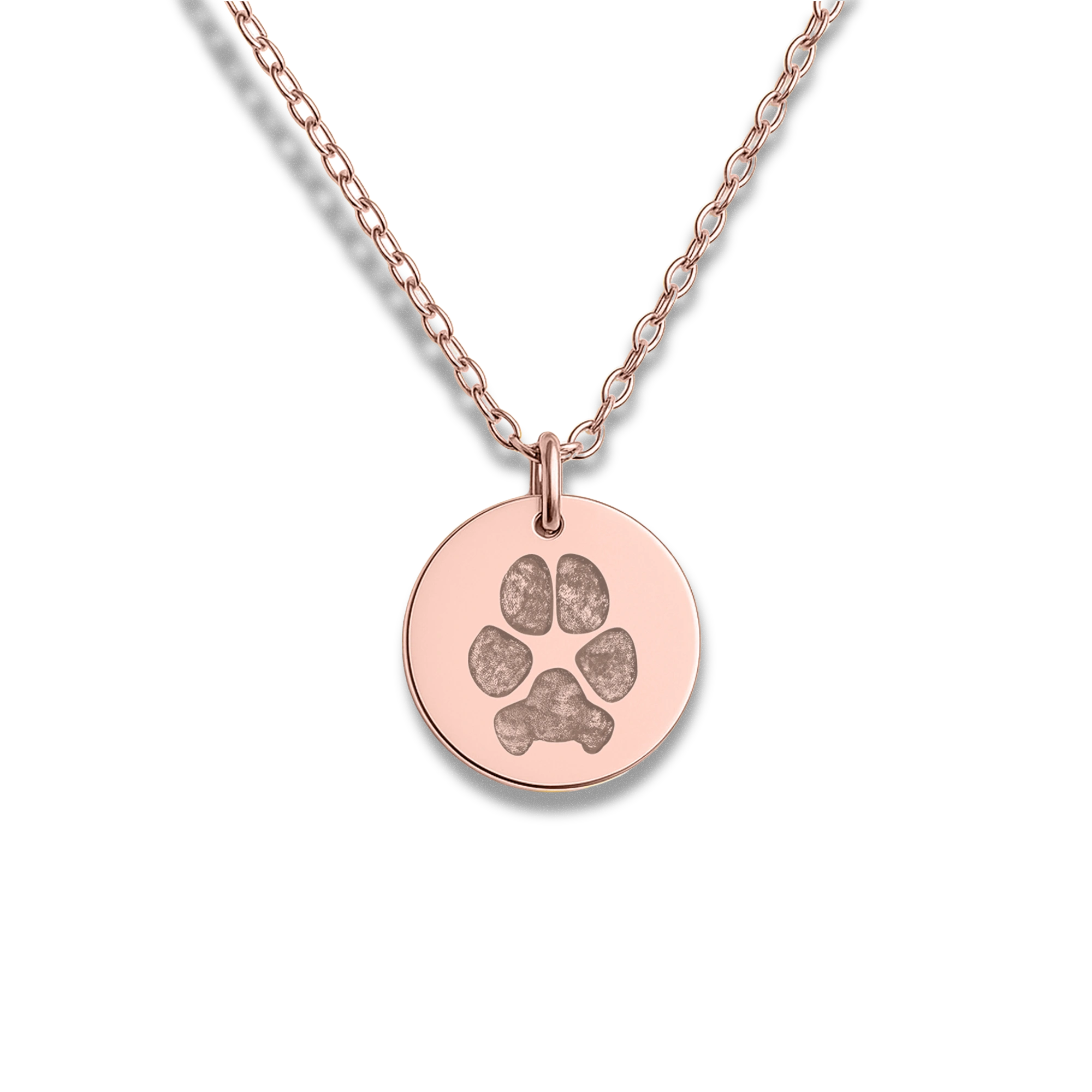 A rose gold necklace with a round pendant featuring an etched paw print for dogs design. The chain is delicate, adding an elegant and sentimental touch.