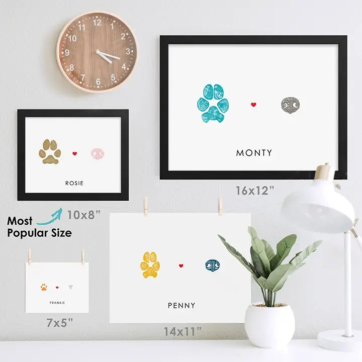 pet paw and nose print keepsakes with cat and dog prints in multiple sizes hung on wall to compare sizes