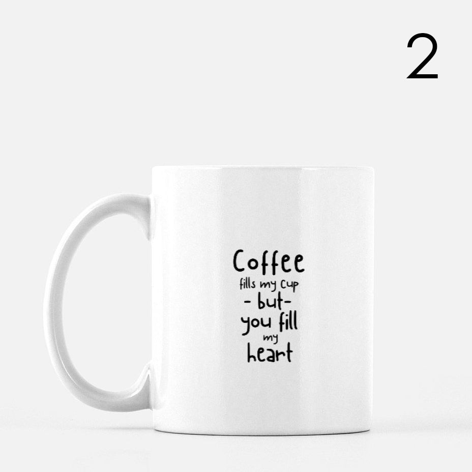 White ceramic mug with black text saying, 