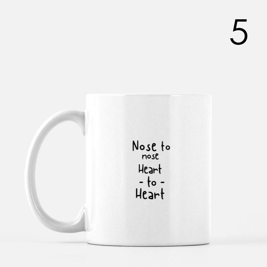White mug with black text, 
