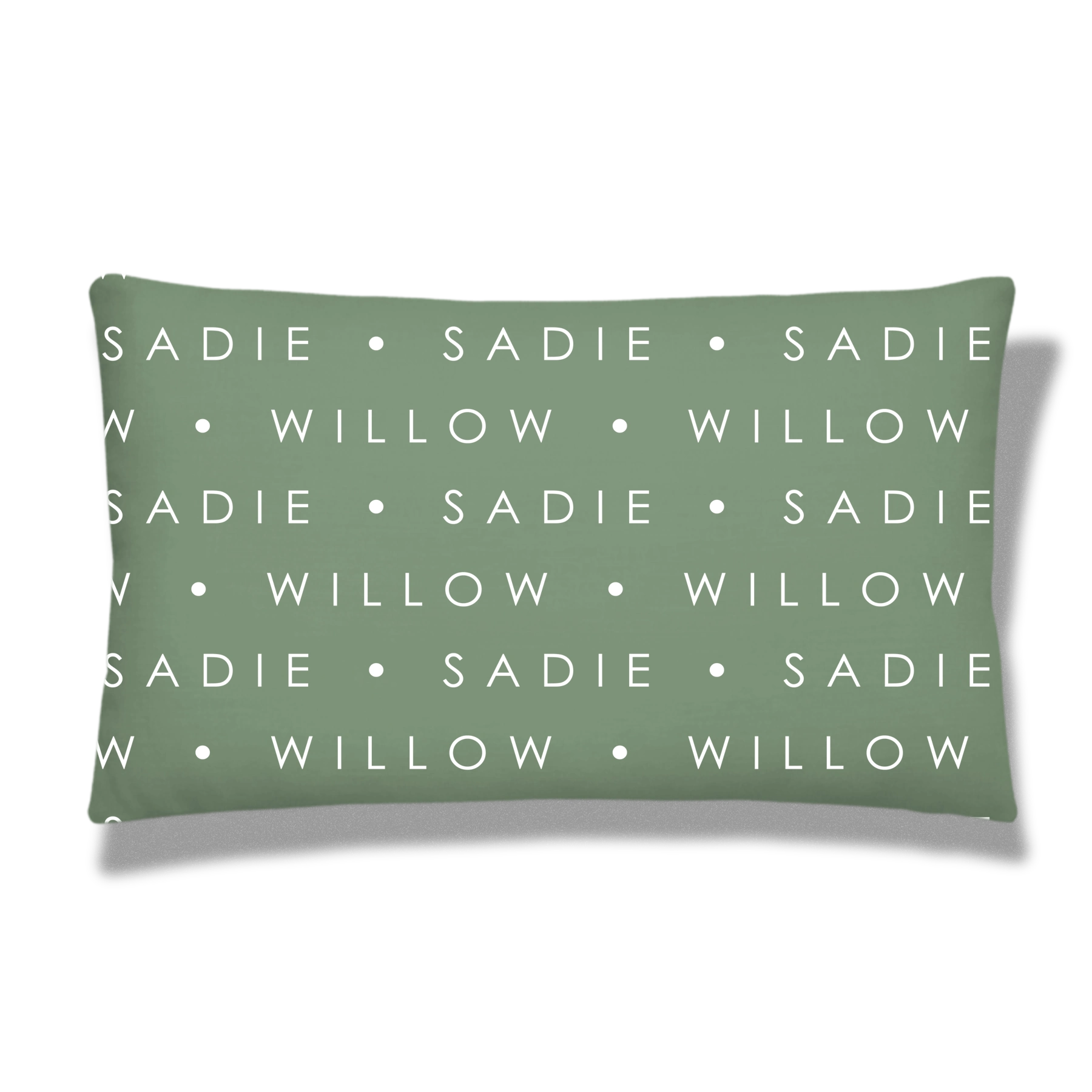 Green rectangular pillow with a pattern of white text saying 