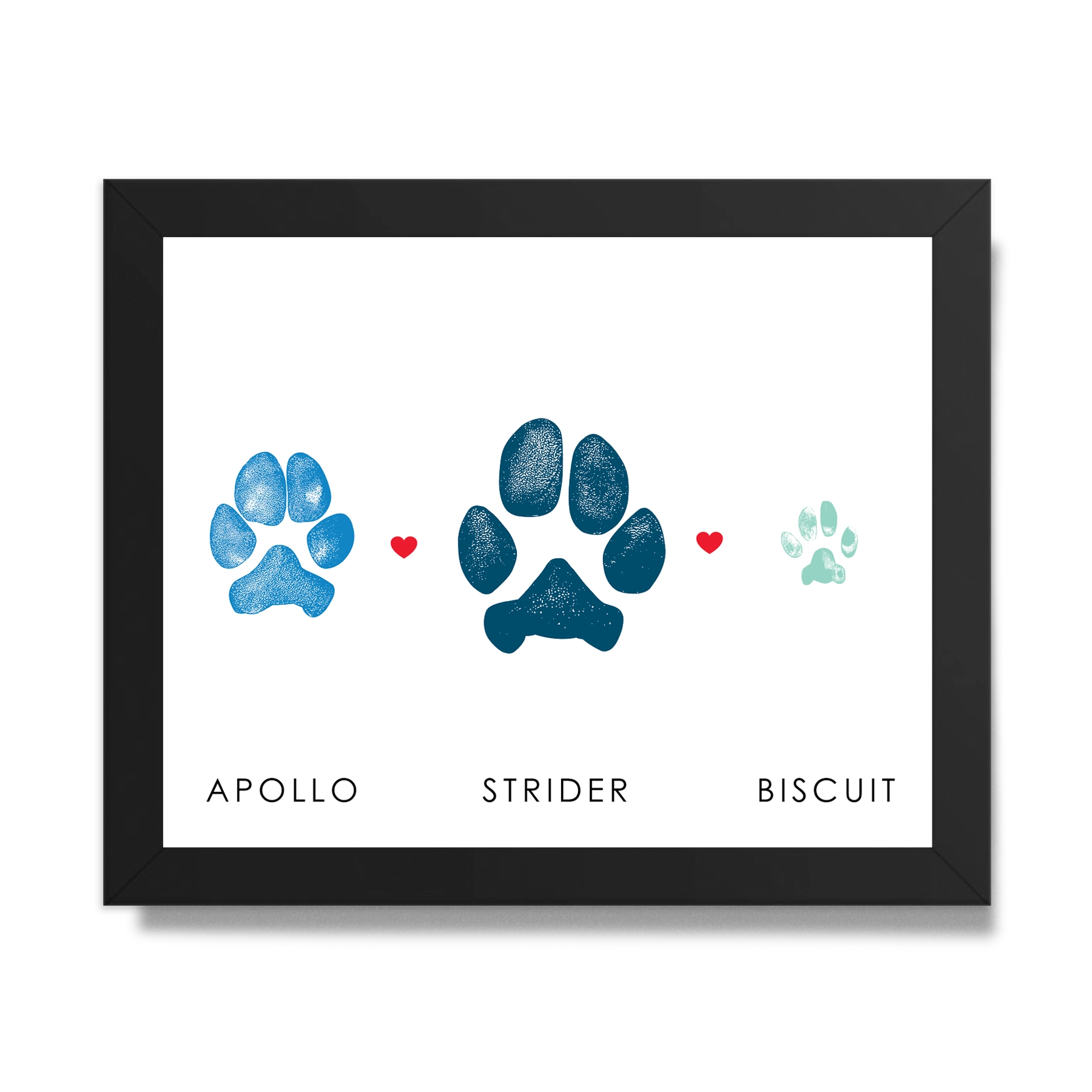 Framed art featuring two dog paw prints and one cat paw print in blue shades with small red hearts between them. Below are the names 