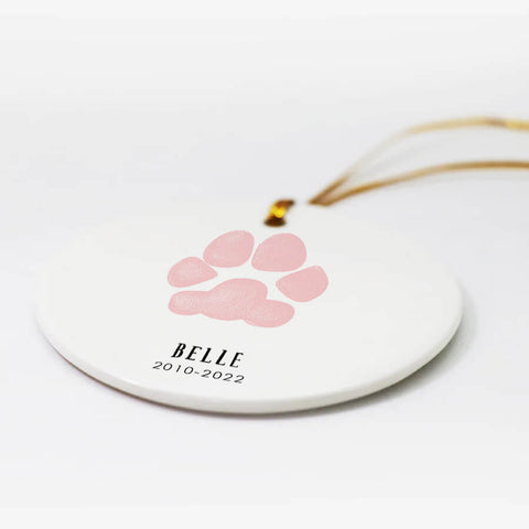 pink dog paw print ornament with memorial date