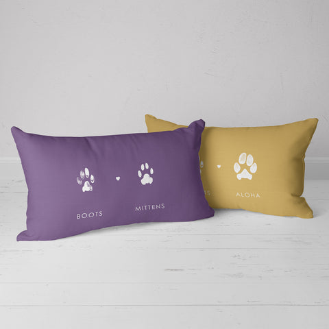 Artfully crafted throw pillow featuring individual paw prints from different pets, sized 20 by 12 inches, cats and dogs