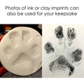 Photos of a dog paw print clay impression and a dog paw ink print 