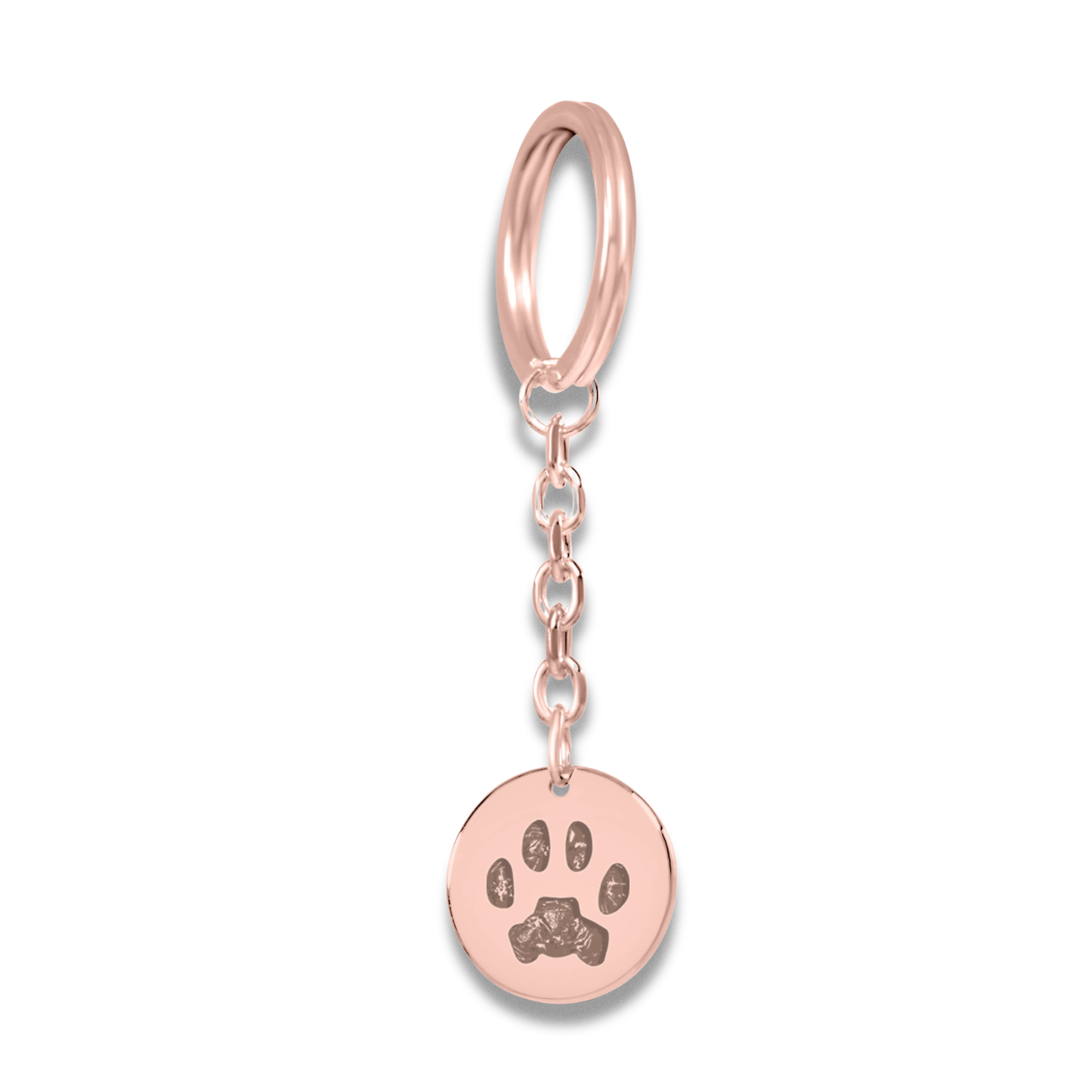 A silver keychain with a round pendant featuring a custom cat nose print.