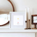 cat memorial display with pet nose print in white frame on mantle