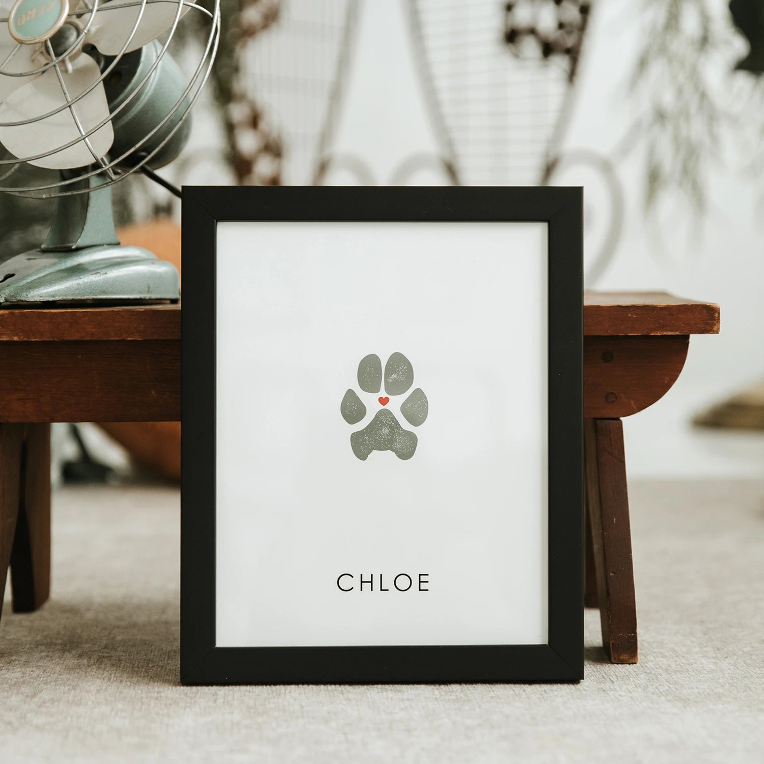 Best Pet Paw Print Impression Keepsake in black frame. Custom dog paw print with red heart in the middle.