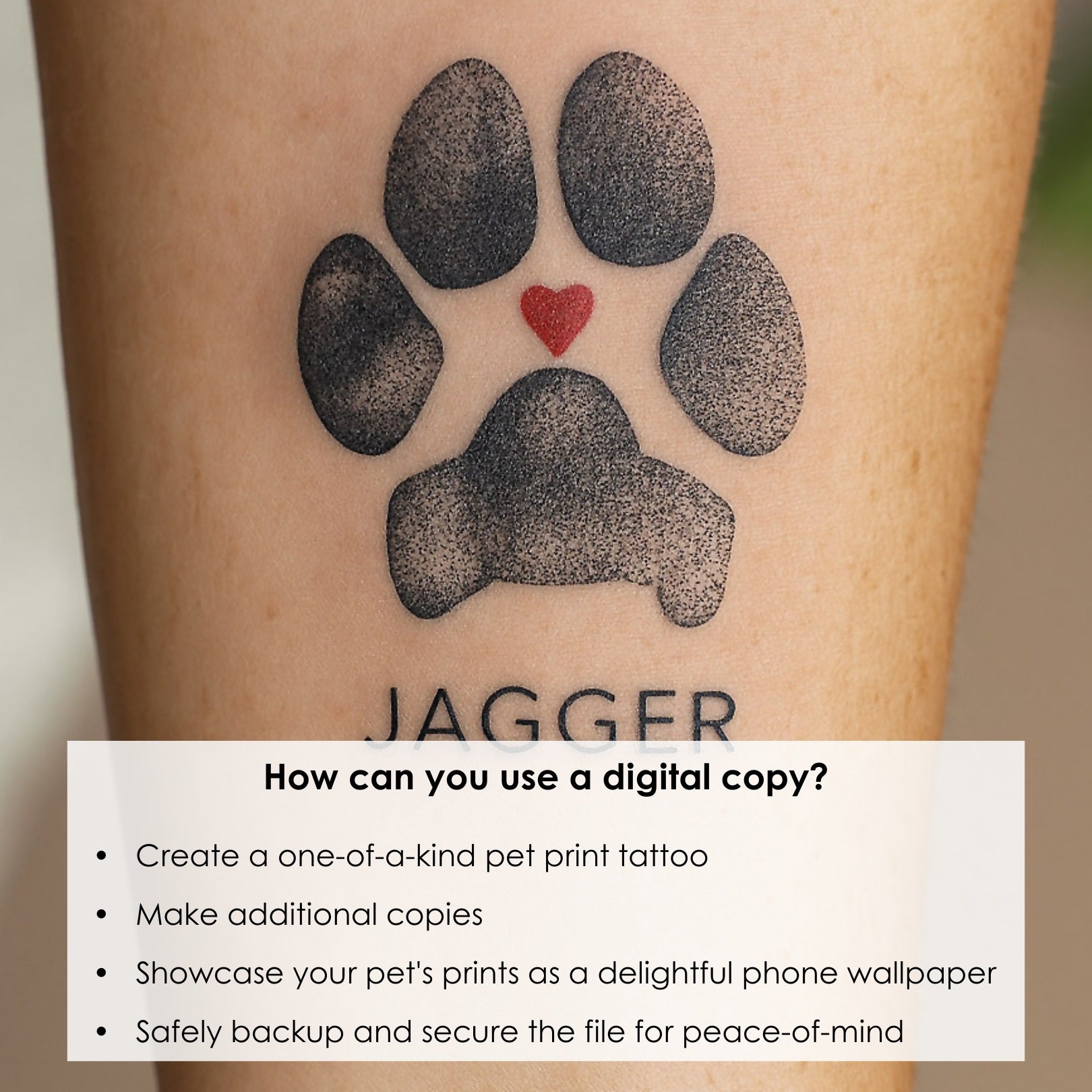 Tattoo of a detailed black dogs paw print with a small red heart above and the name "Jagger" beneath. It conveys love and connection to a pet.