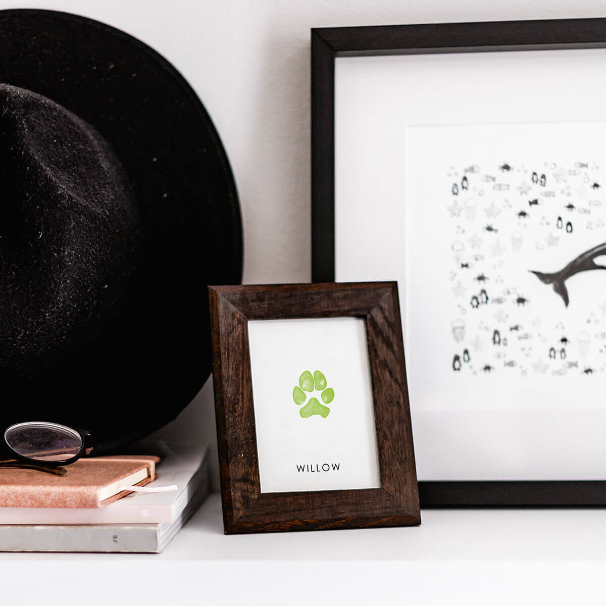 framed paw print on decorated shelf