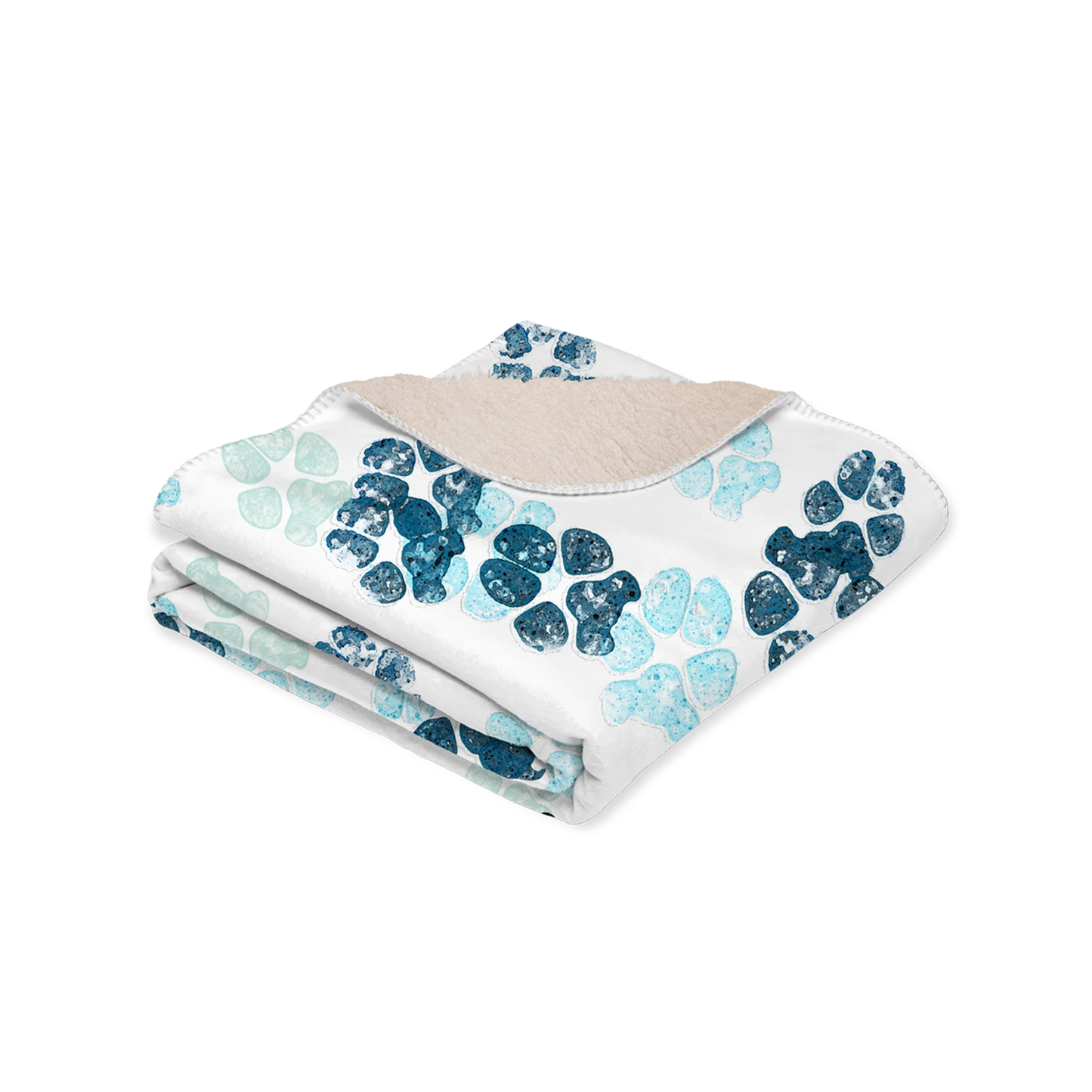 White blanket with scattered custom pet paw prints in shades of blue. The design feels playful.