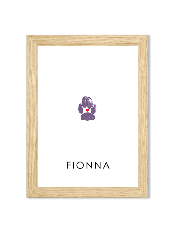A purple cat paw print framed in a natural wood frame with the name 