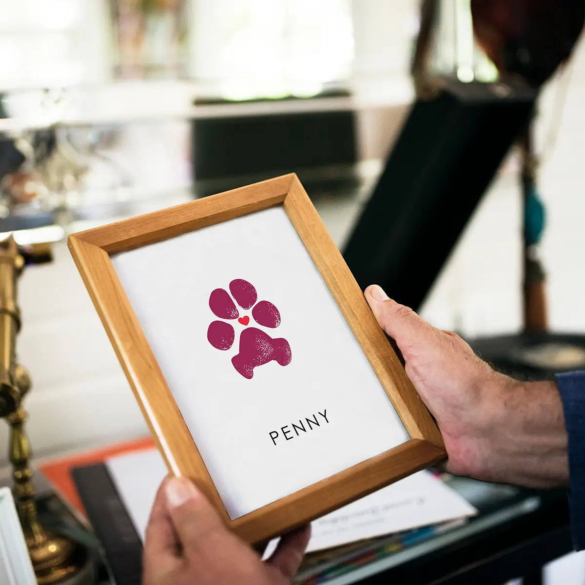 Best Pet Paw Print Impression Keepsake in black frame. Custom dog paw print with red heart in the middle.