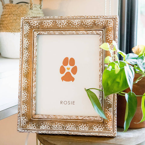 orange dog paw print in decorative frame for memorial