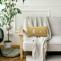 dog memory pillow with real paw and nose prints on white couch