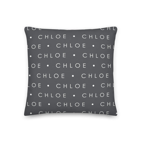 Gray pillow with cat name repeating pattern in white