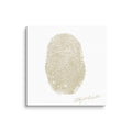 one tan colored fingerprint on a canvas  with custom signature in bottom right corner