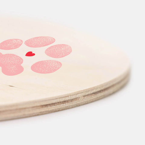 side view of wooden sign with pink dog paw print