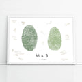 couple thumbprints in green placed side by side in white frame with wedding guest signatures