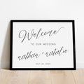 black cursive script personalized wedding ceremony welcome sign