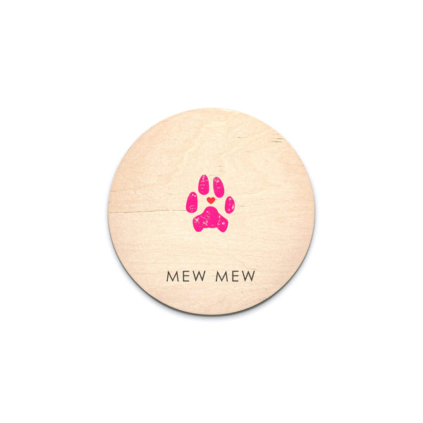 hot pink cat paw print on round wooden sign with pet name
