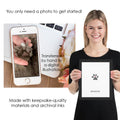 woman showing final cat paw print made from photo of cats paw