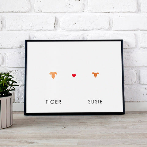 Two small cat nose prints stamped in orange with heart in the middle of artwork and personalized with pet names